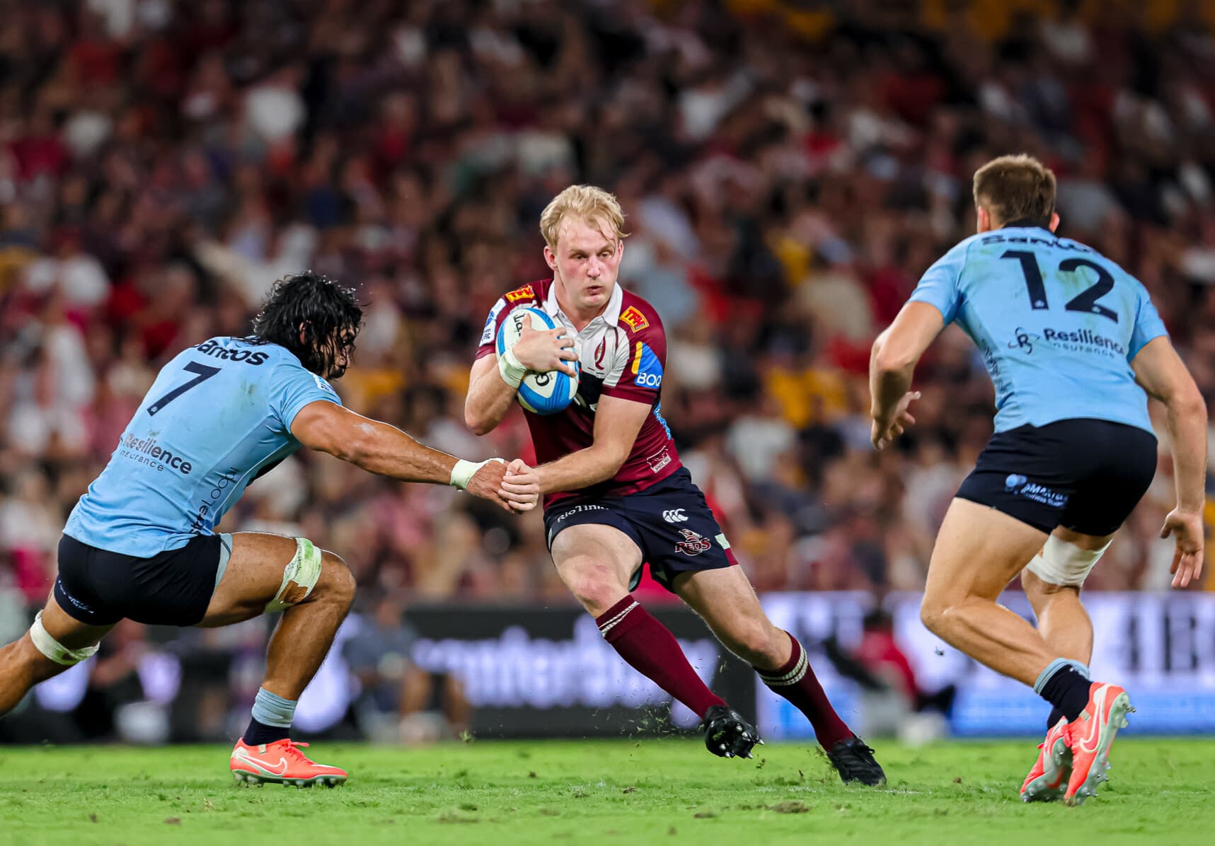 Reds flyhalf Tom Lynagh sizes up the play against the NSW Waratahs at Suncorp Stadium