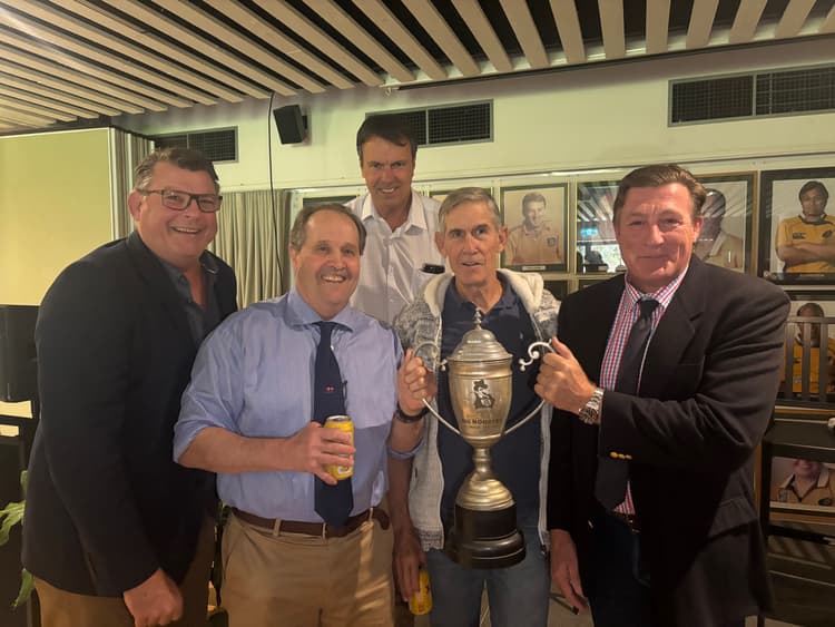 Old Dogs reunion...1985 Wests premiership winners (from left) Troy Coker, Bill Abram, Phil Mooney, Roger Gould and Julian Gardner with the Big Rooster trophy