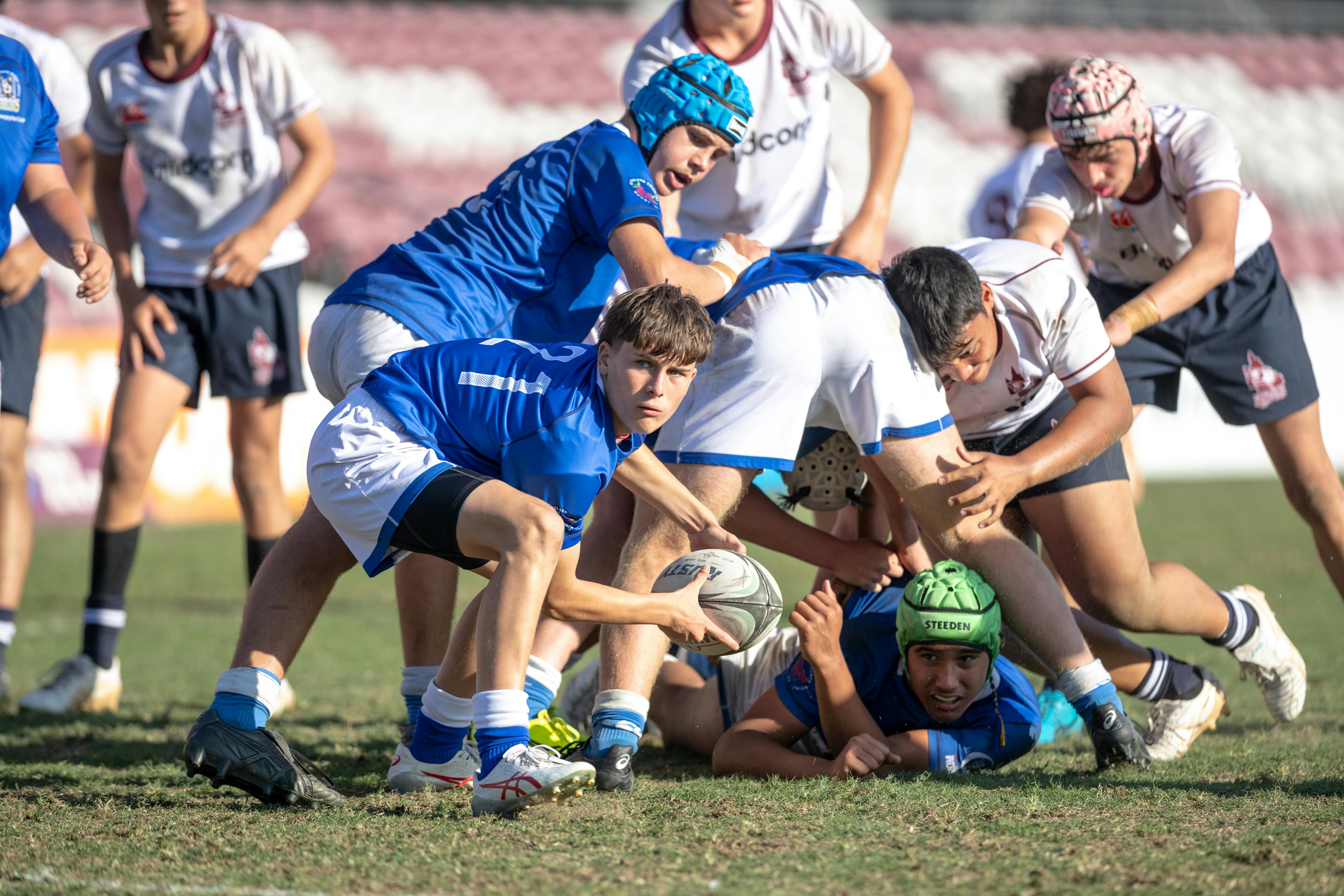 Halfback Coby Hill clears from the ruckbase for Queensland Country in the Under-14s.