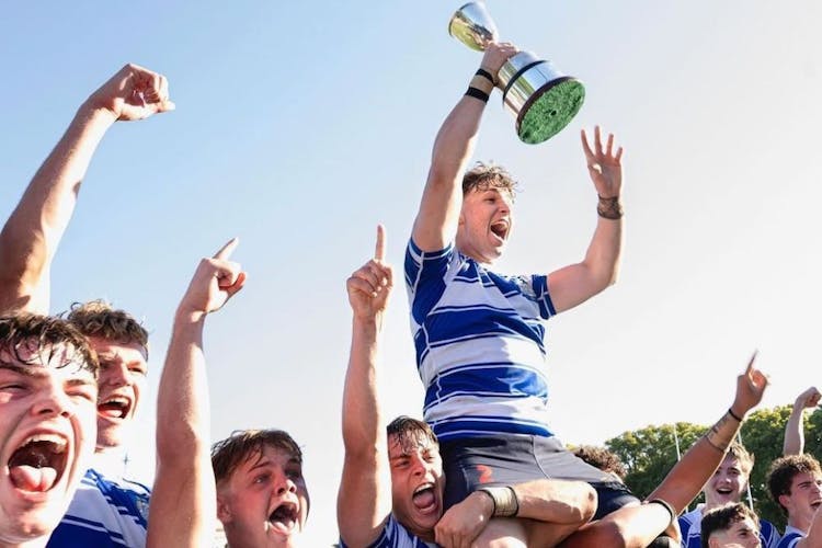 Skipper John Grenfell (with trophy) and Nudgee College teammates celebrate today's First XV rugby premiership. Photo courtesy Nudgee College Facebook