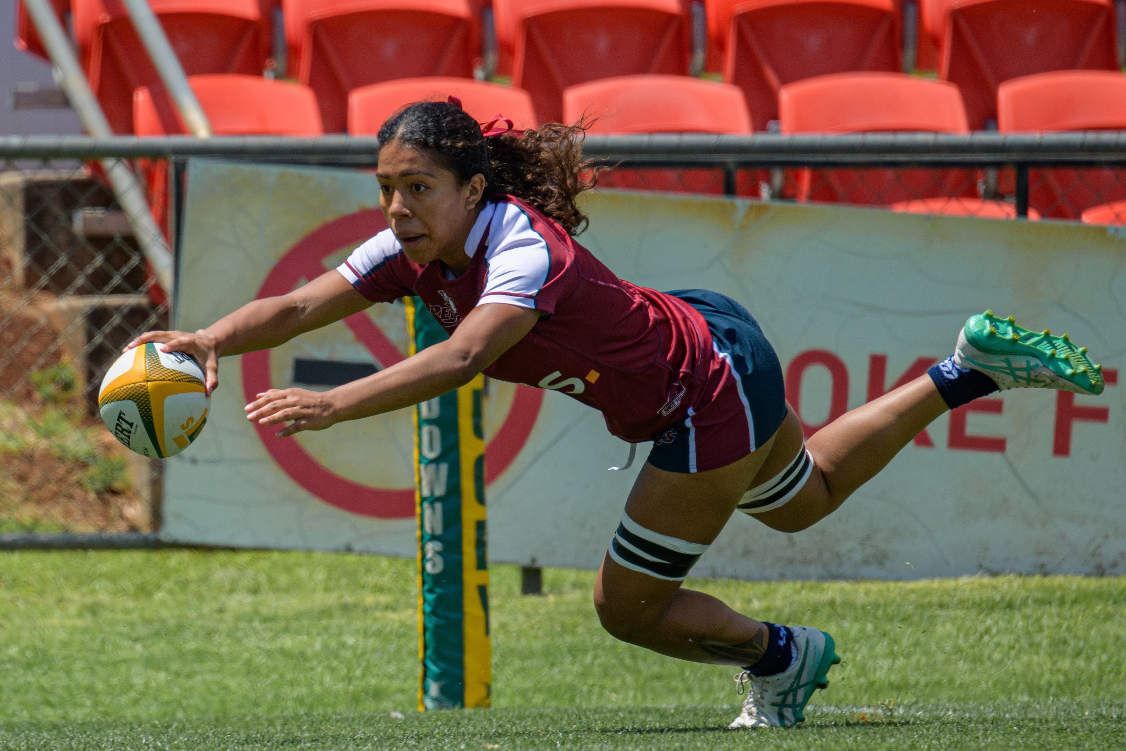 Queensland's Fleur Ginn scores against the NSW Waratahs at the Next Gen 7s in Toowoomba.