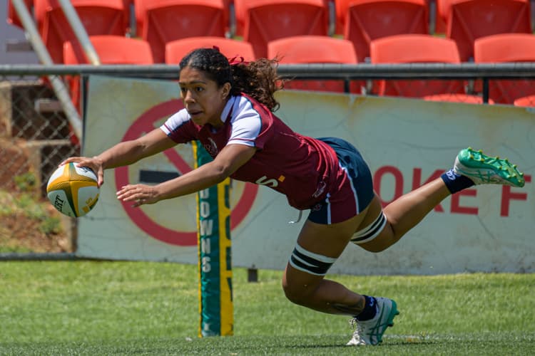 Queensland's Fleur Ginn scores against the NSW Waratahs at the Next Gen 7s in Toowoomba.