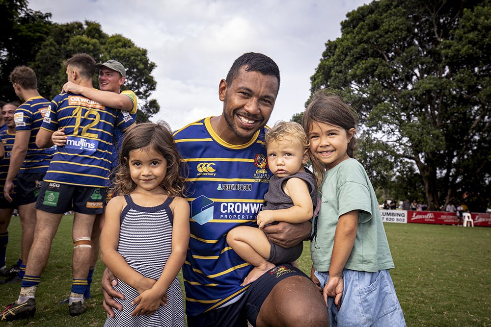 Aidan Toua with his three children after Easts win over Gordon. Photo Credit: Brendan Hertel/QRU 